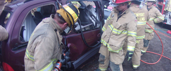 Firefighters prying open car door